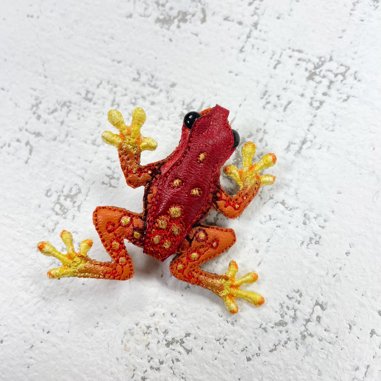 Handcrafted red and yellow spotted frog brooch