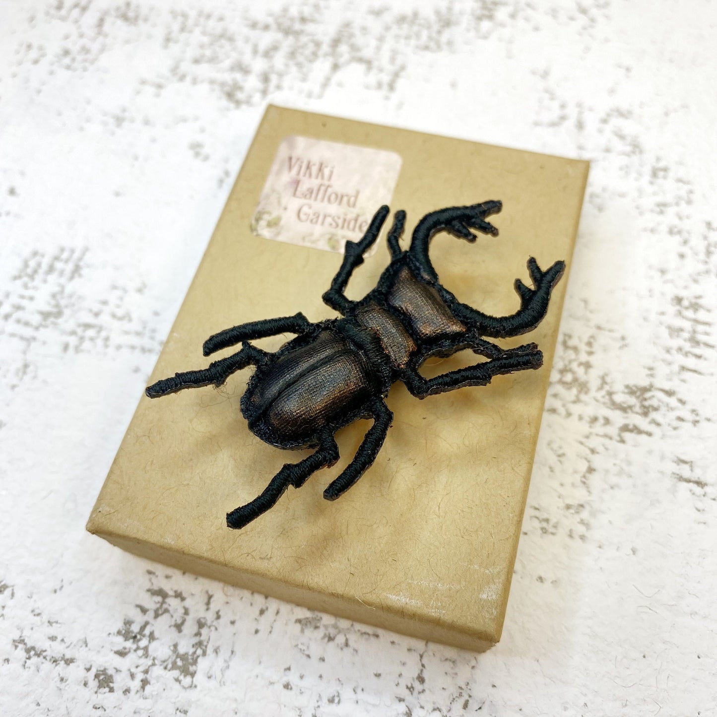Stag beetle brooch