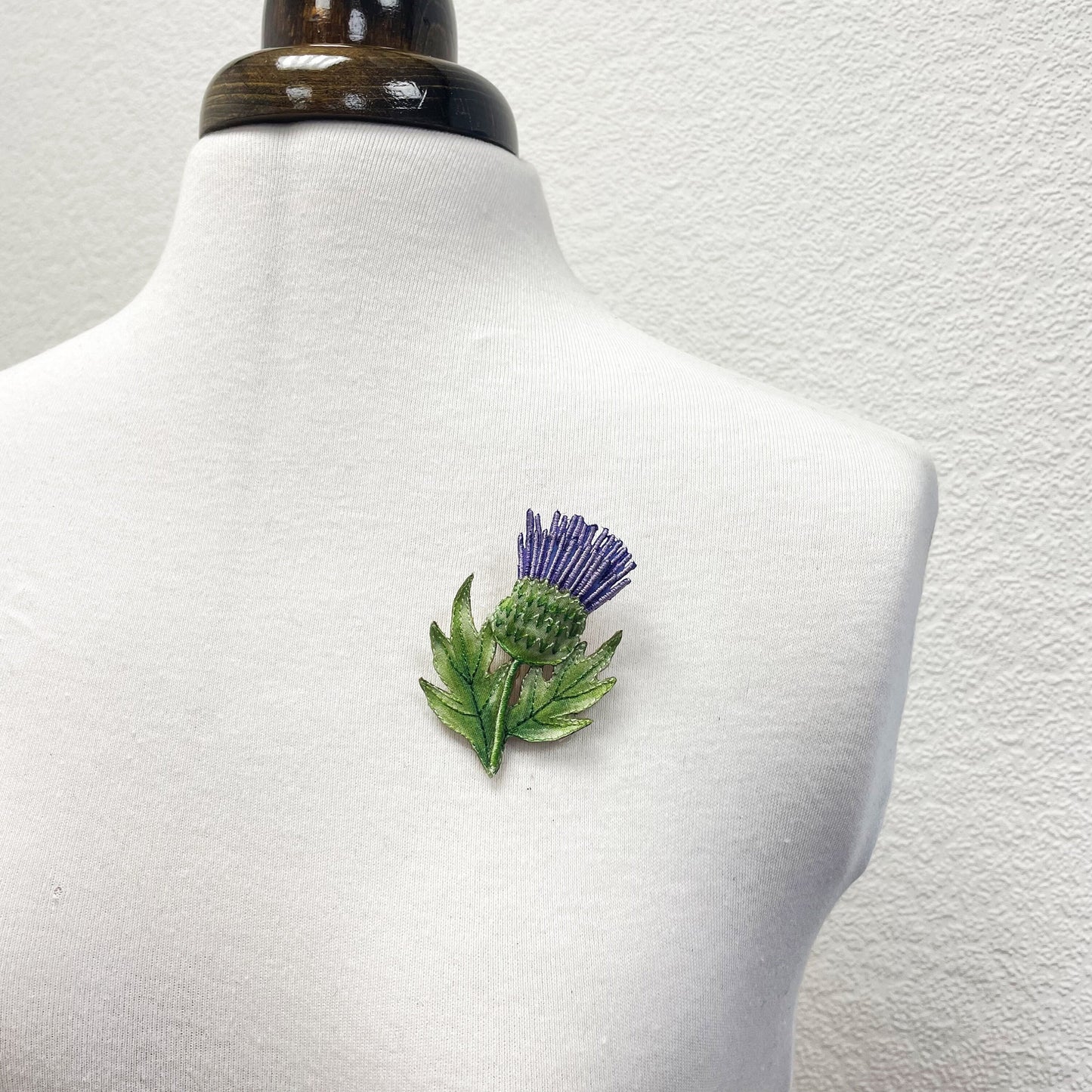 Embroidered and hand painted thistle brooch