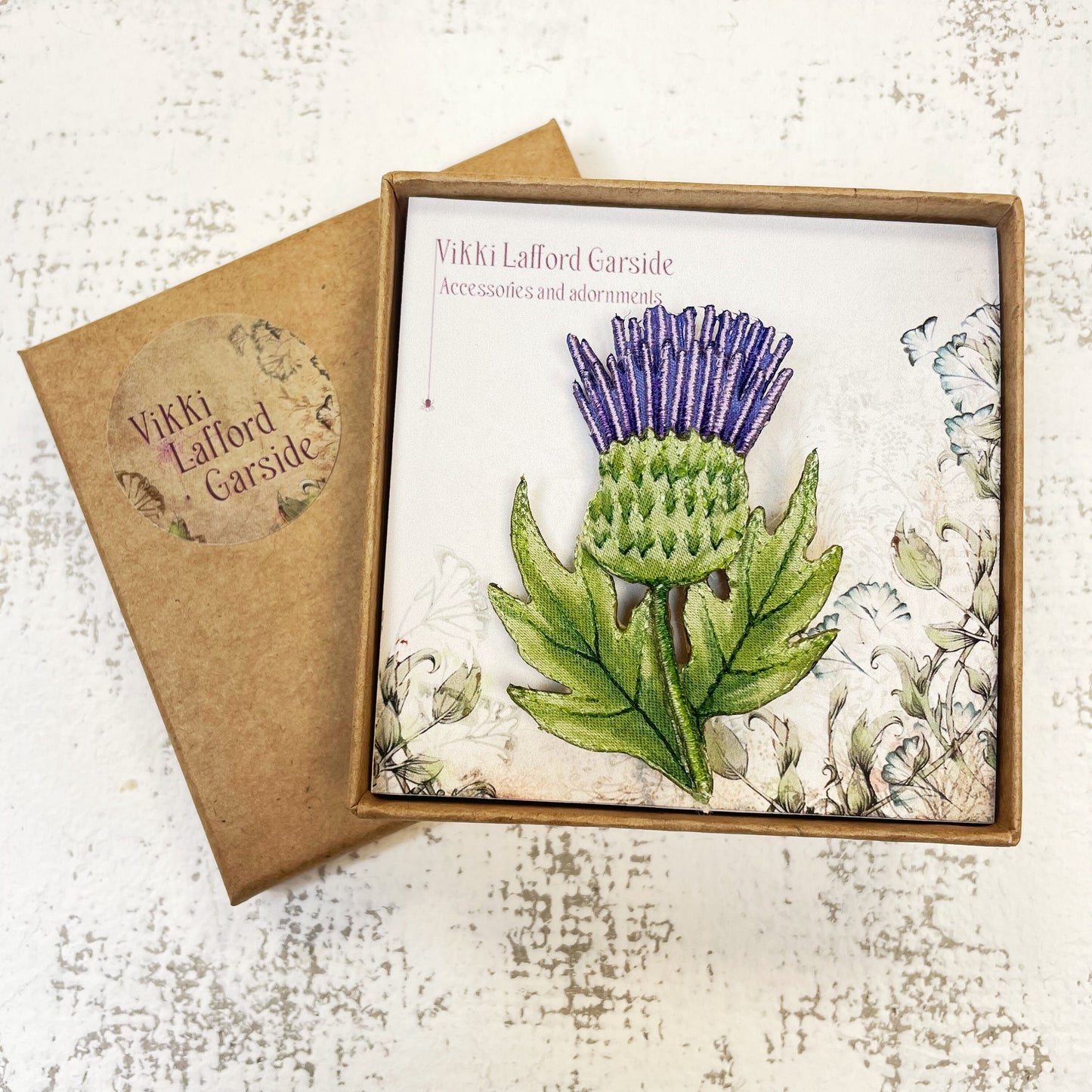 Embroidered and hand painted thistle brooch