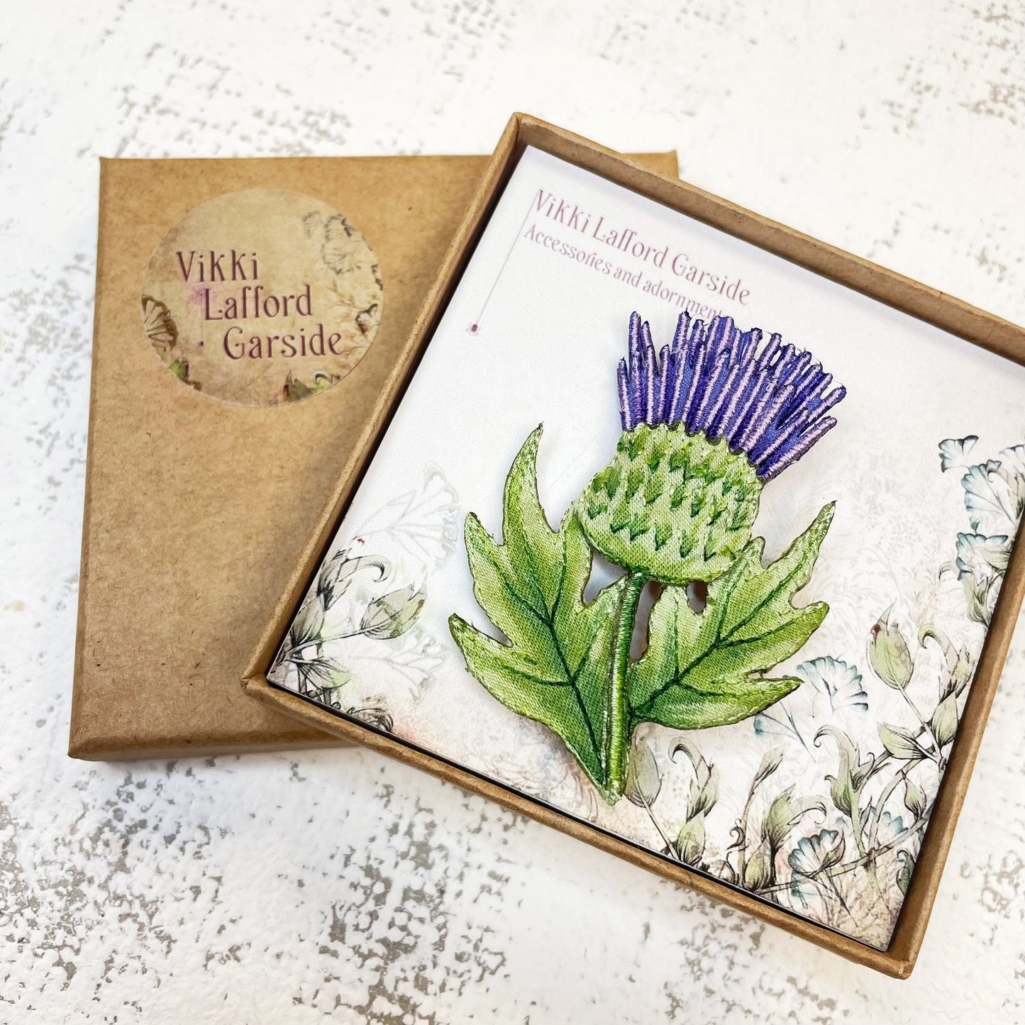Embroidered and hand painted thistle brooch