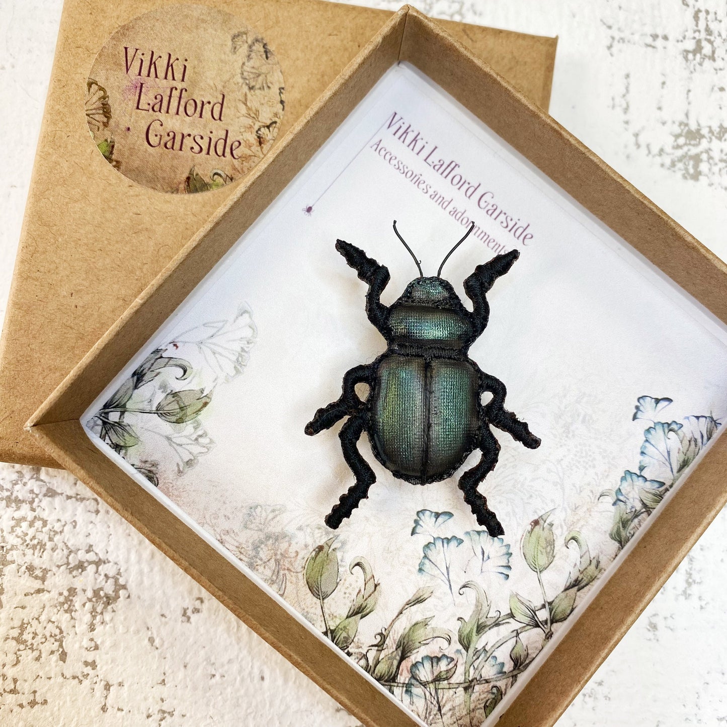 Handcrafted black beetle brooch