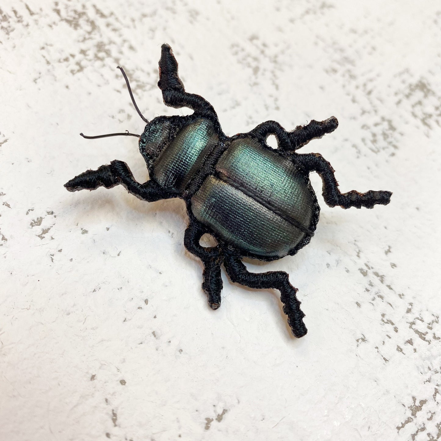 Handcrafted black beetle brooch