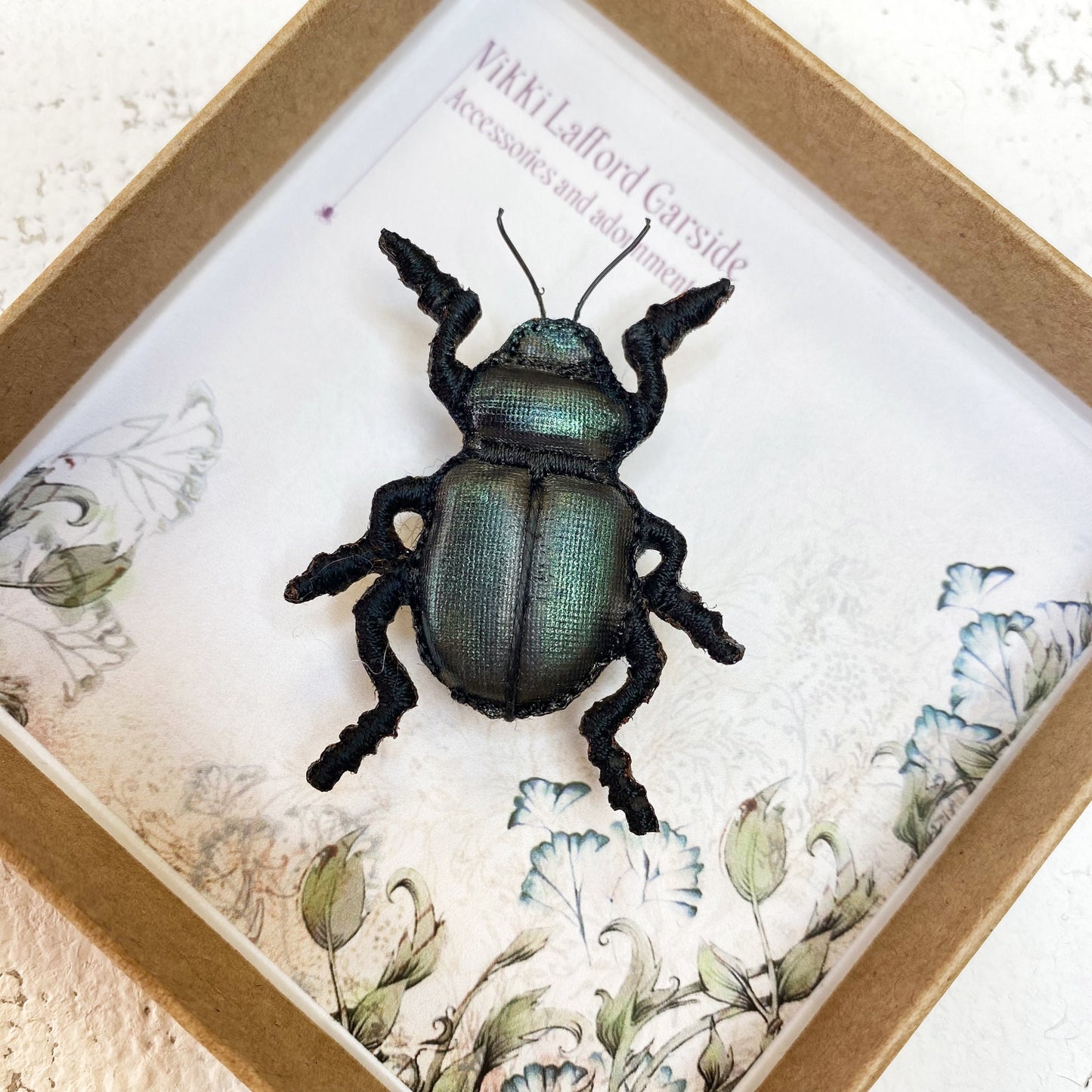 Handcrafted black beetle brooch