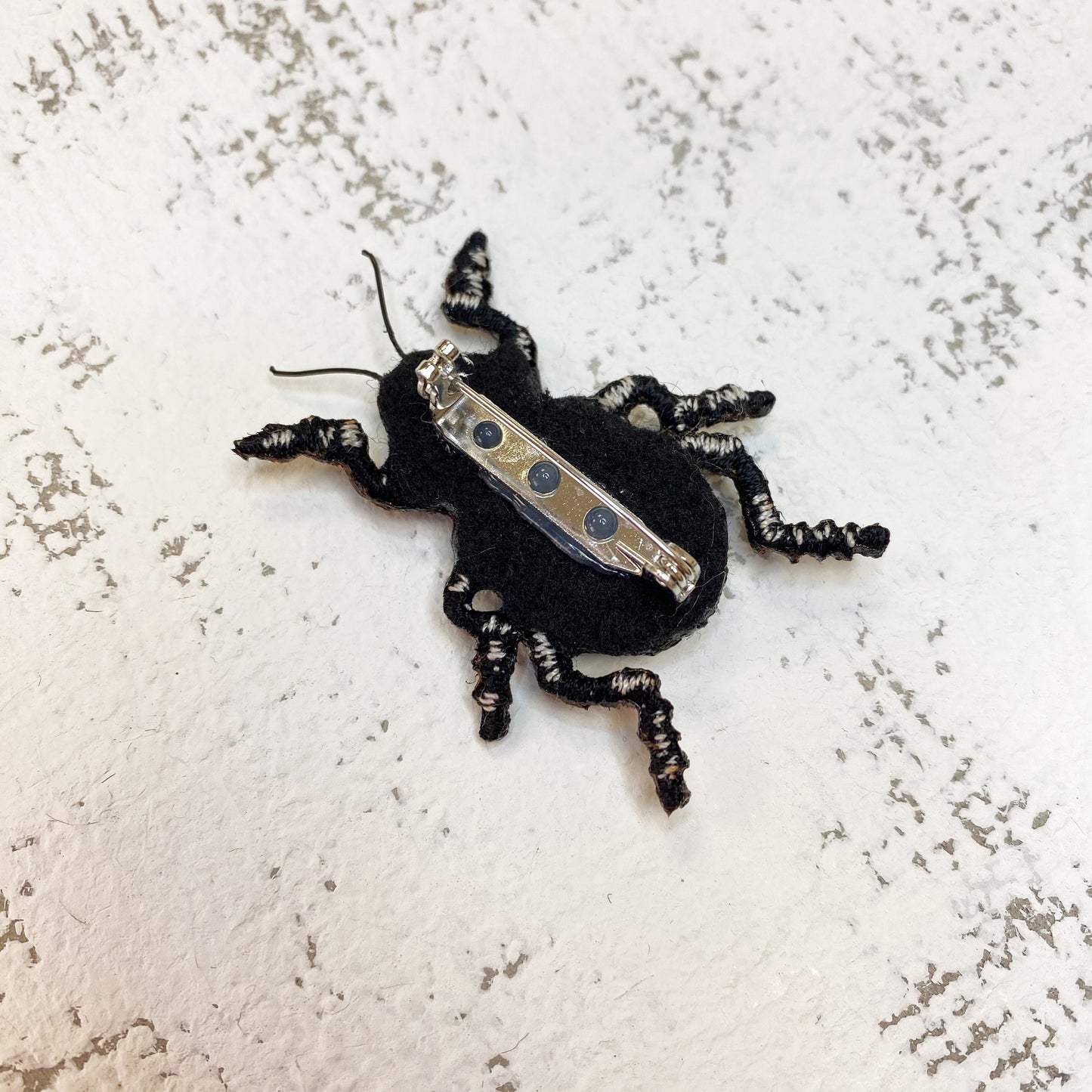 Handcrafted black beetle brooch