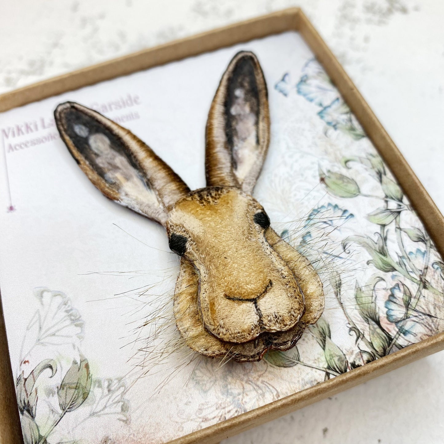Embroidered and hand painted hare brooch