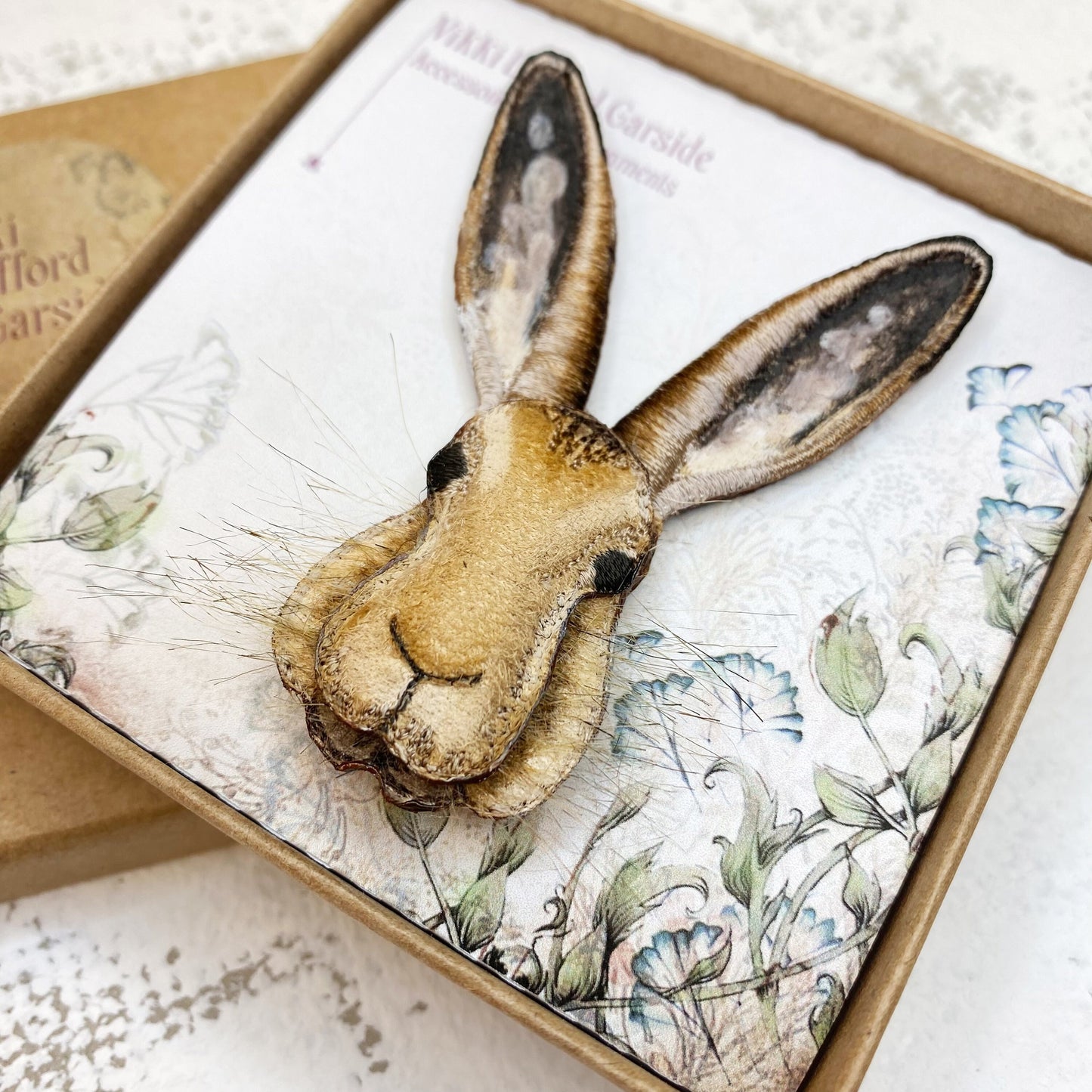 Embroidered and hand painted hare brooch