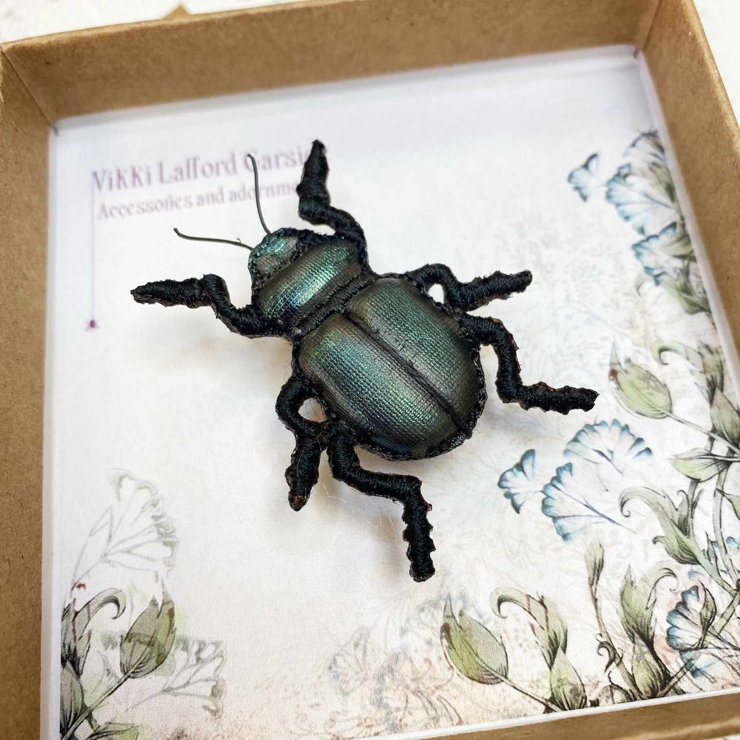 Handcrafted black beetle brooch