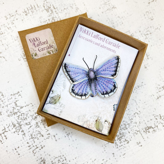 Blue and white butterfly brooch