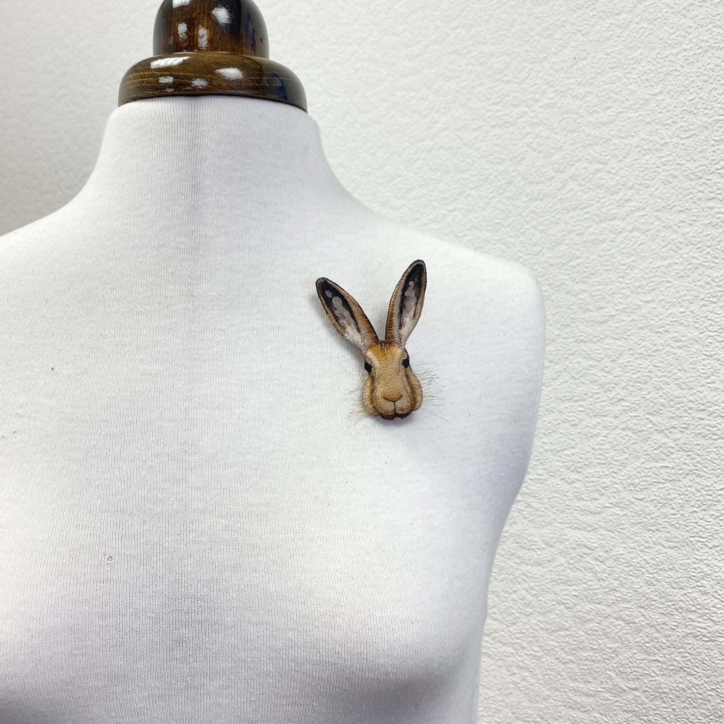 Embroidered and hand painted hare brooch