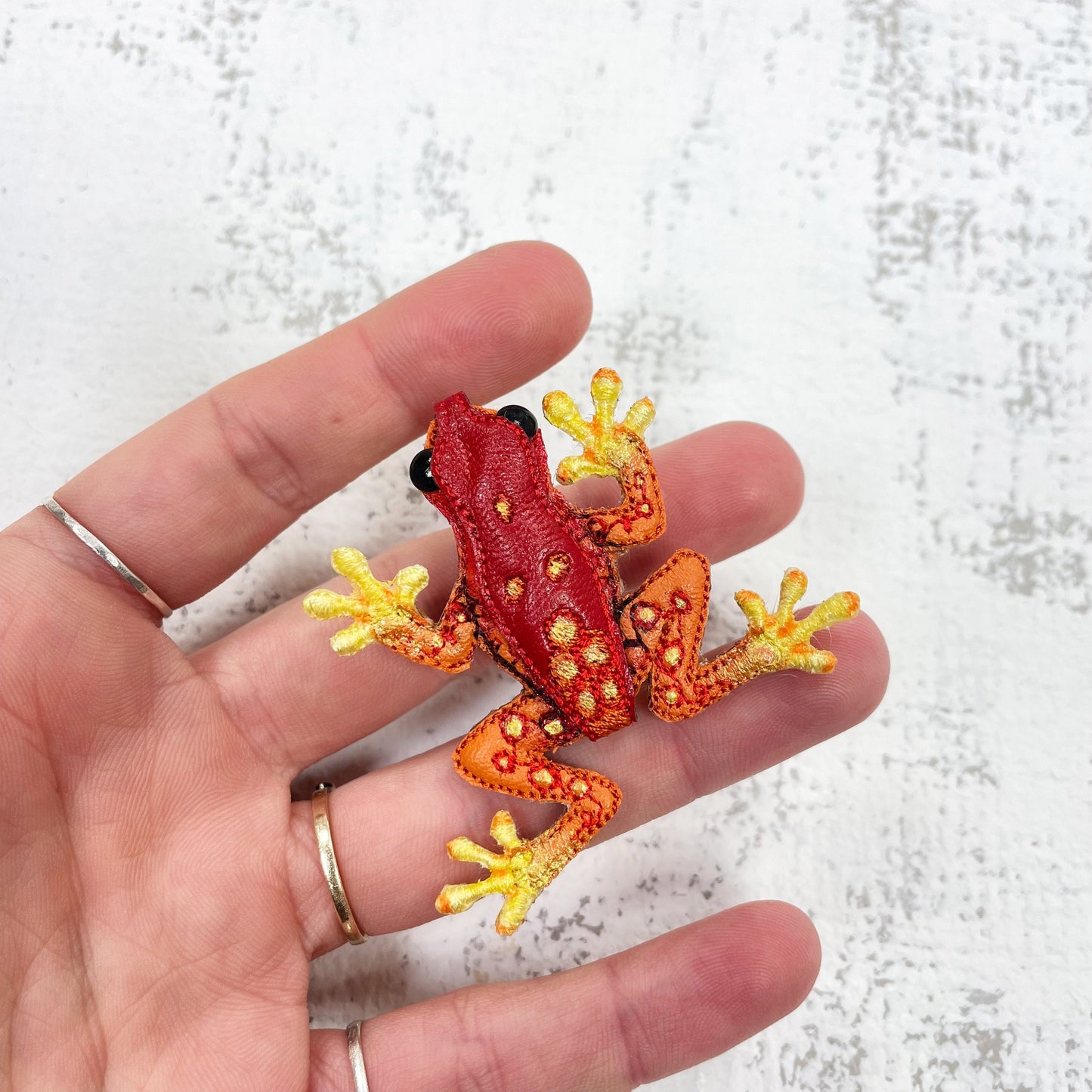Handcrafted red and yellow spotted frog brooch